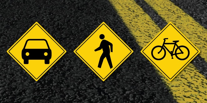 Road with street sign icons for a car, pedestrian and bicycle.